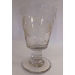 A 19thC glass goblet, the bucket shaped bowl wheel engraved with thistles and other meadow flowers,