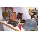 20thC German military related items: to include a pink fabric table lamp shade,