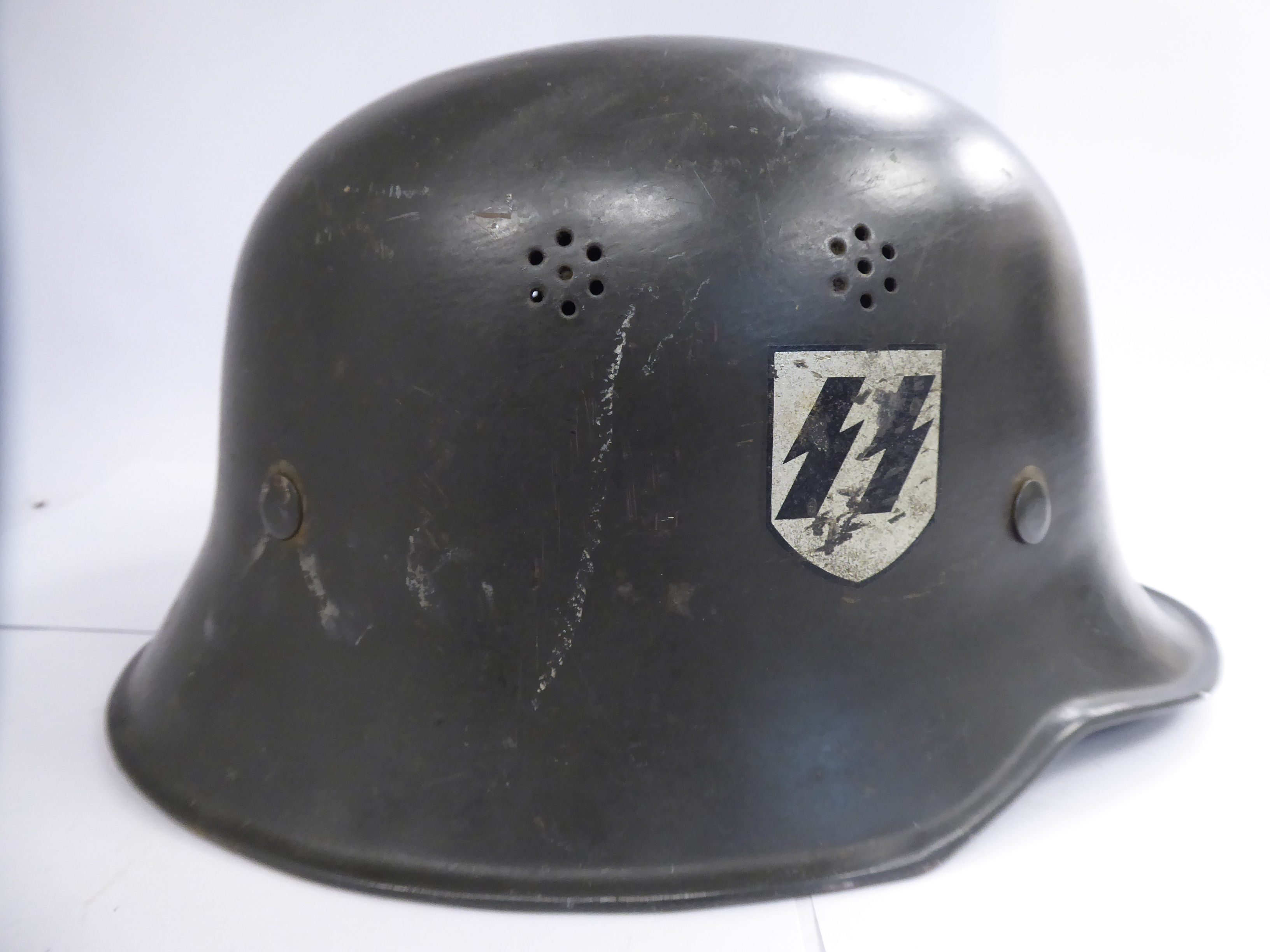 A German green painted SS helmet with a hide lining and decals (Please Note: this lot is offered - Image 5 of 8