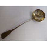 A George III silver fiddle pattern soup ladle with an oval bowl William Chawner London 1810