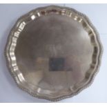 A Georgian style silver waiter with a gadrooned and piecrust border,