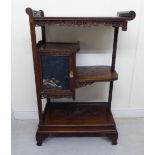 A late 19thC Japanese mahogany Shadona, the shelves with carved tiers and borders,