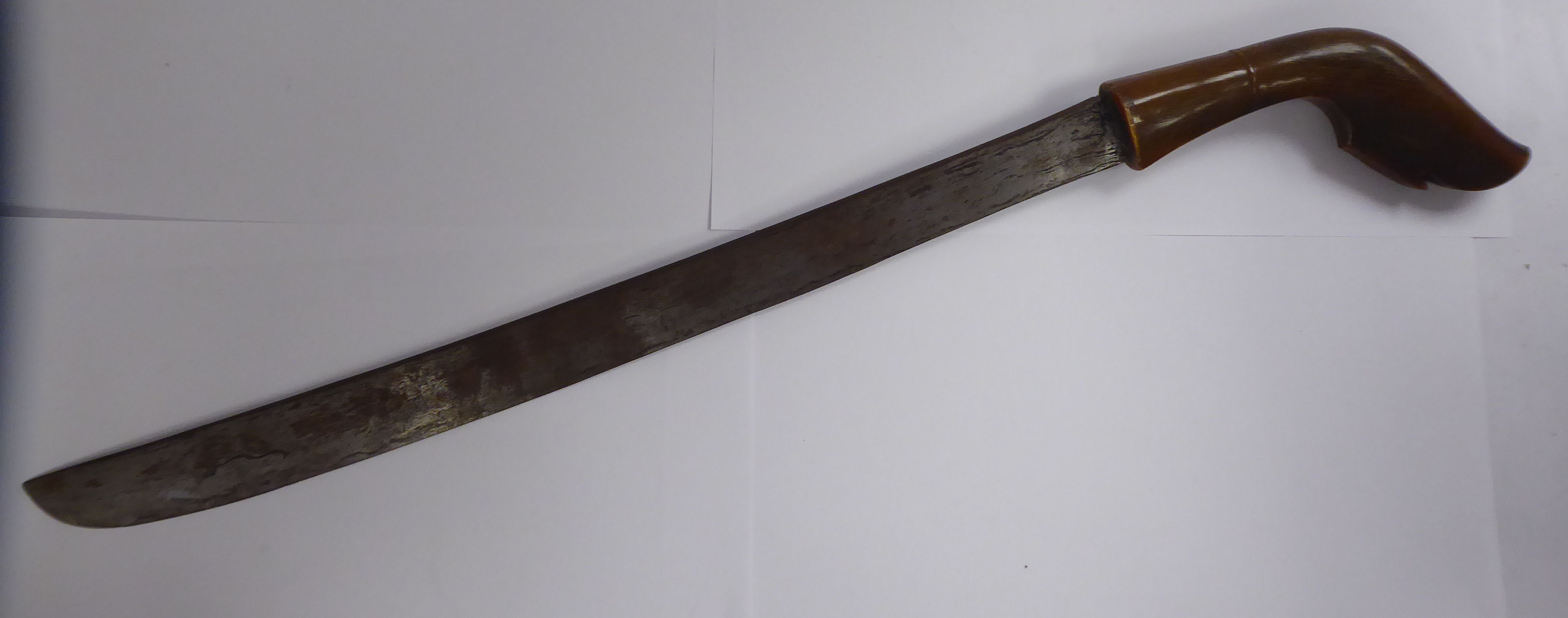 An 'antique' Japanese short sword with a carved horn handle,