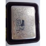 A late Victorian silver folding notelet/card/postage stamp case with scrolled,