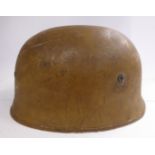 A German brown painted parachutist's helmet with a hide lining and chinstrap (Please Note: this