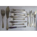 A set of six early 20thC Italian silver coloured metal fish knives and forks;