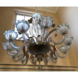 A Murano twelve branch opaque glass chandelier with a floral encrusted central column and