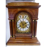 An Edwardian satinwood string inlaid, mahogany cased bracket clock with a stepped, domed top,