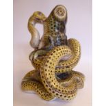 A late 19thC Continental glazed earthenware model, a toad under attack by a python 6.