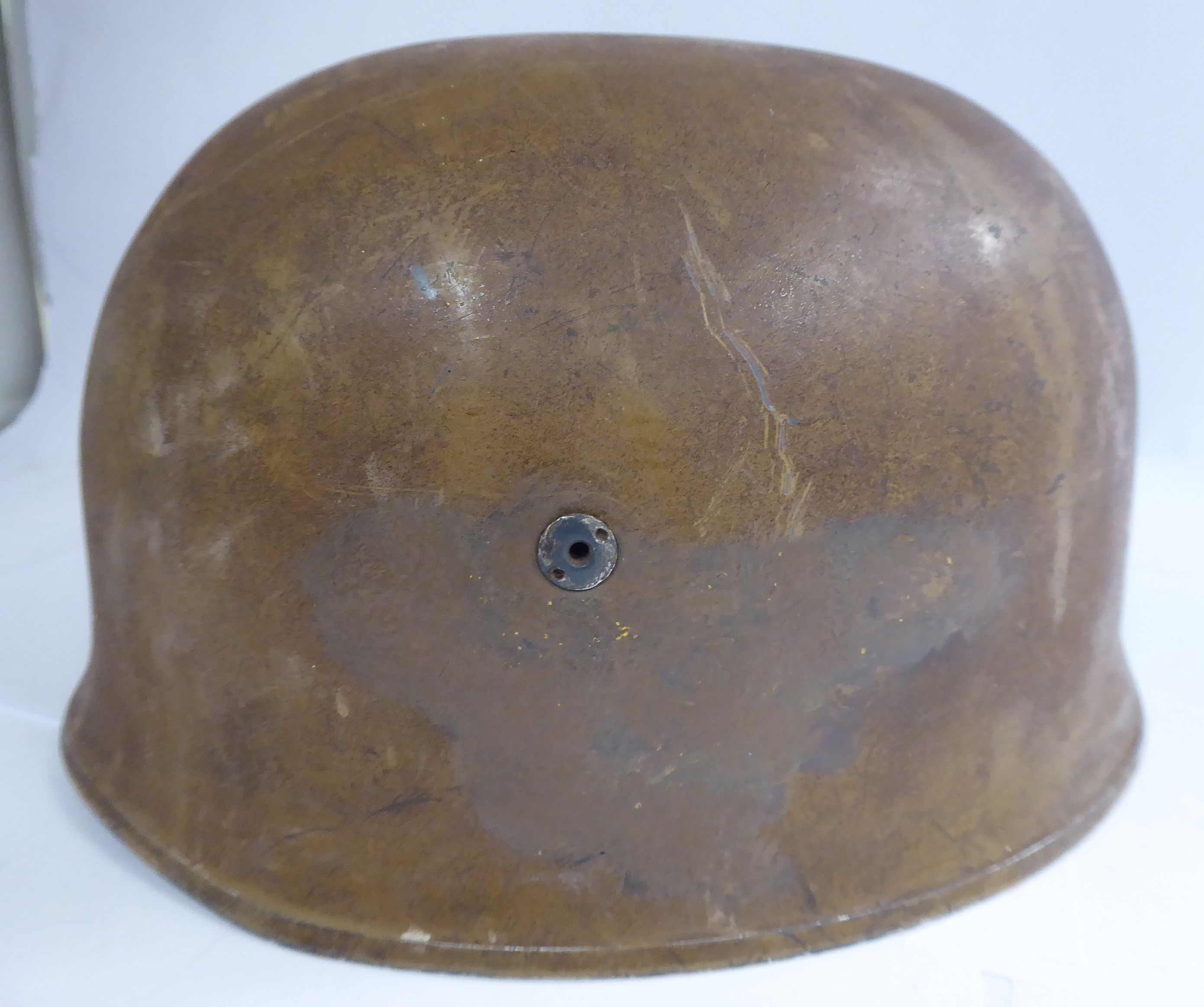 A German brown painted parachutist's helmet with a hide lining and chinstrap (Please Note: this - Image 3 of 8