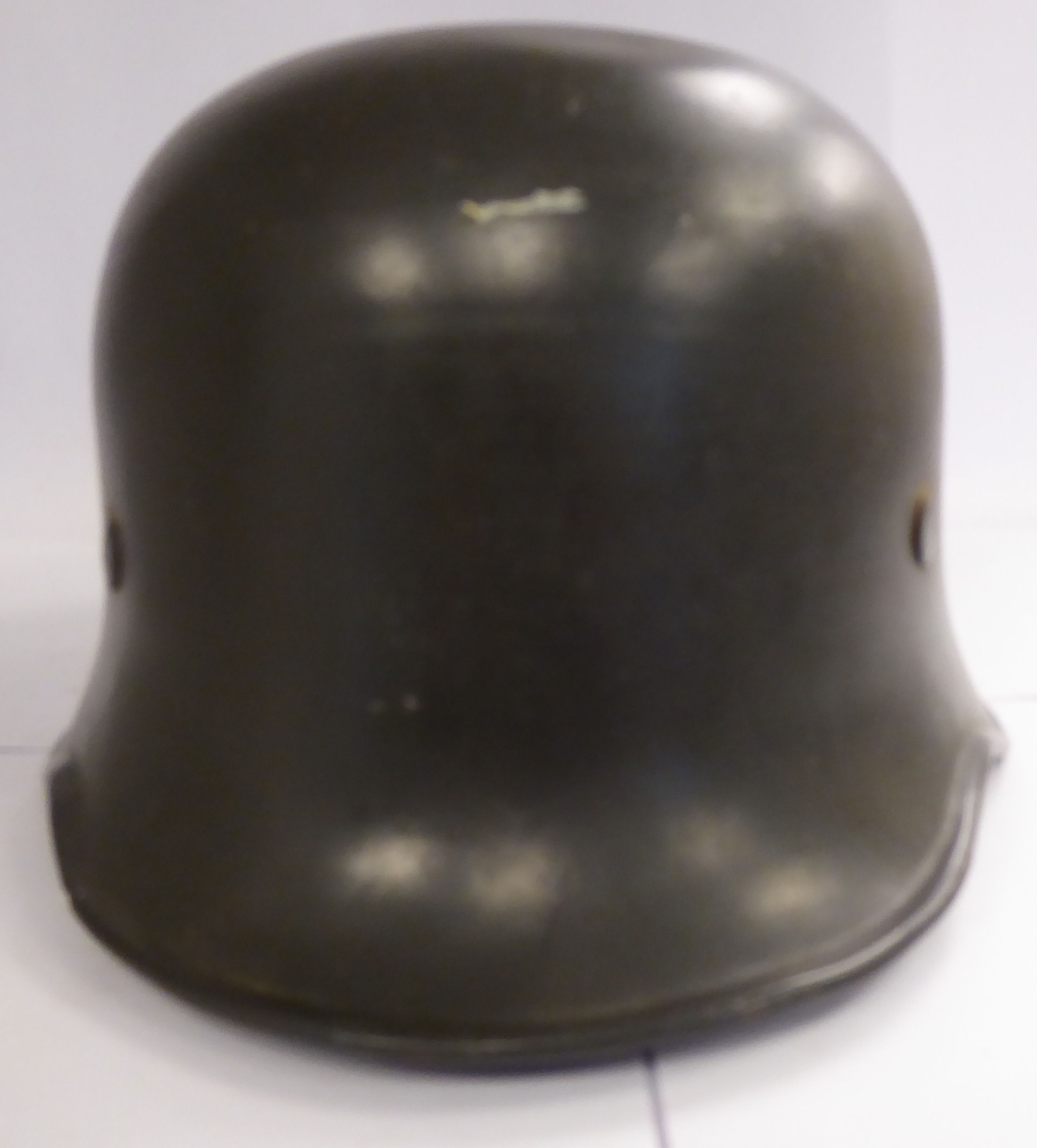 A German green painted SS helmet with a hide lining and decals (Please Note: this lot is offered - Image 2 of 8