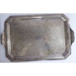 An Iraqi silver coloured metal tray, having a raised border,