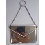 A silver envelope design card case with a sprung hinged flap,