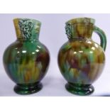 A pair of mid Victorian Wedgwood green and brown drip glazed majolica earthenware bulbous vases