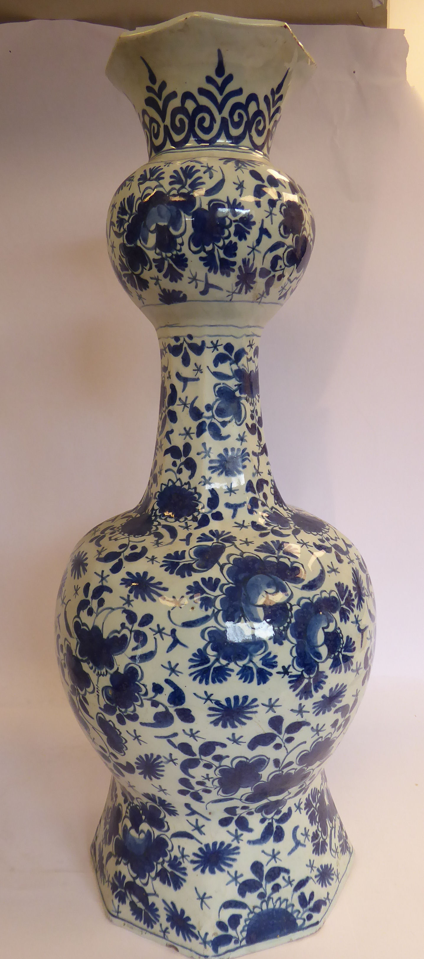 A late 18thC Dutch Delft, octagonal outlined vase of waisted bulbous form, the narrow,