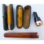 Four similar 'antique' cigar/cheroot holders,