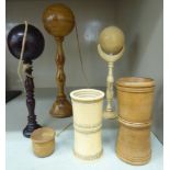 Early 20thC carved and turned ivory and wooden games related artefacts: to include two similar