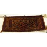 A Bokhara saddle sack, decorated with repeating stylised diamond motifs,