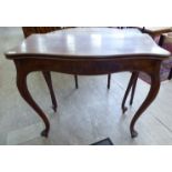 A late 19thC (probably French) mahogany serpentine front tea table with a foldover top,