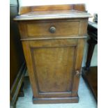 A late Victorian mahogany pot cupboard with a galleried top,