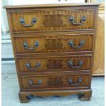 A modern crossbanded mahogany finished four drawer dressing chest,