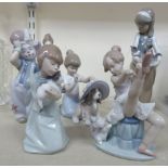 Five Lladro porcelain figures: to include a girl holding two kittens 10''h TOS9