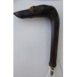An Edwardian carved ebony parasol handle,