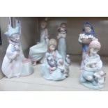 Six Lladro porcelain figures: to include a girl holding a basket of four kittens 9''h OS10