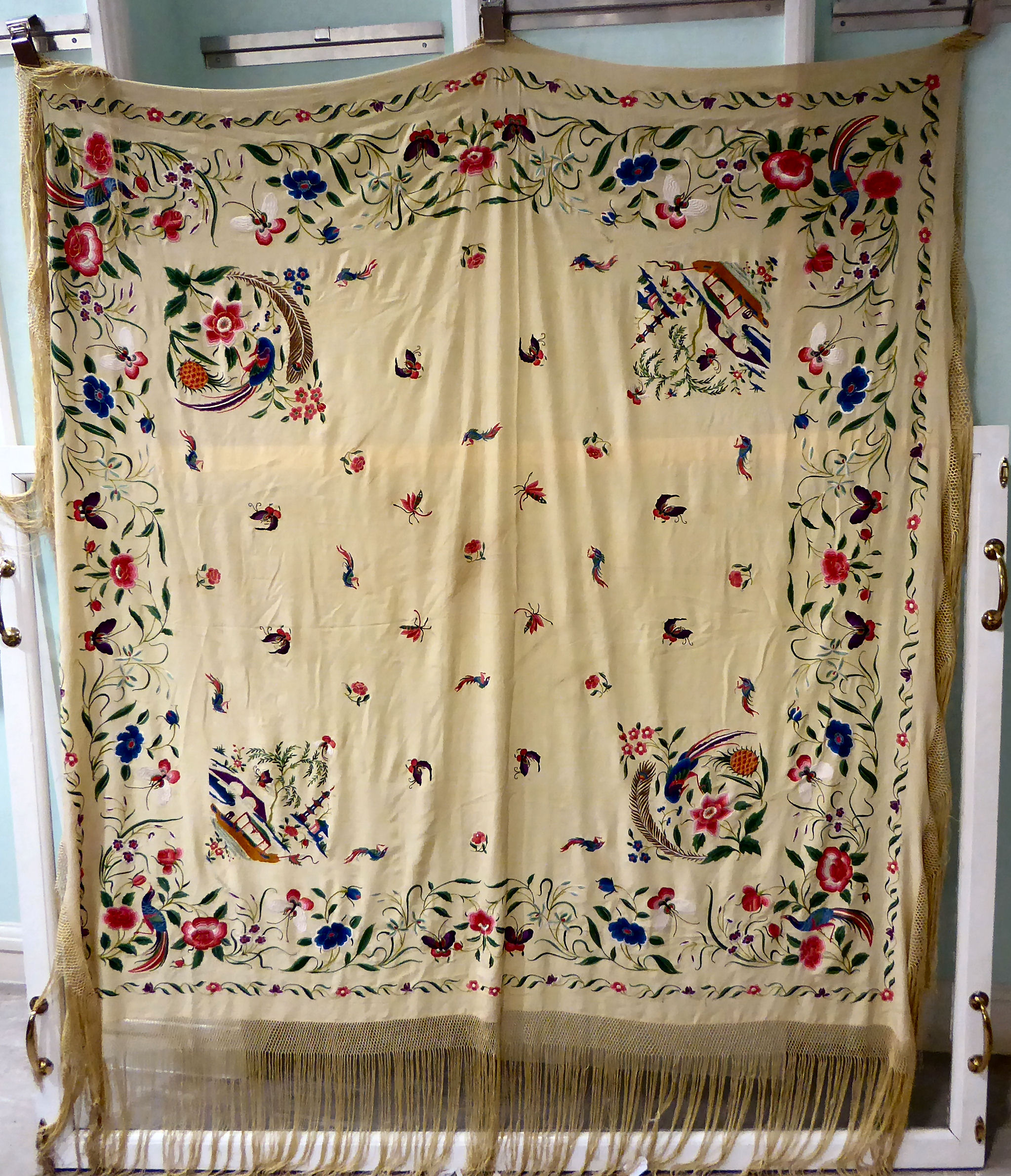 An Orientally inspired tasselled silk shawl,