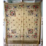An Orientally inspired tasselled silk shawl,