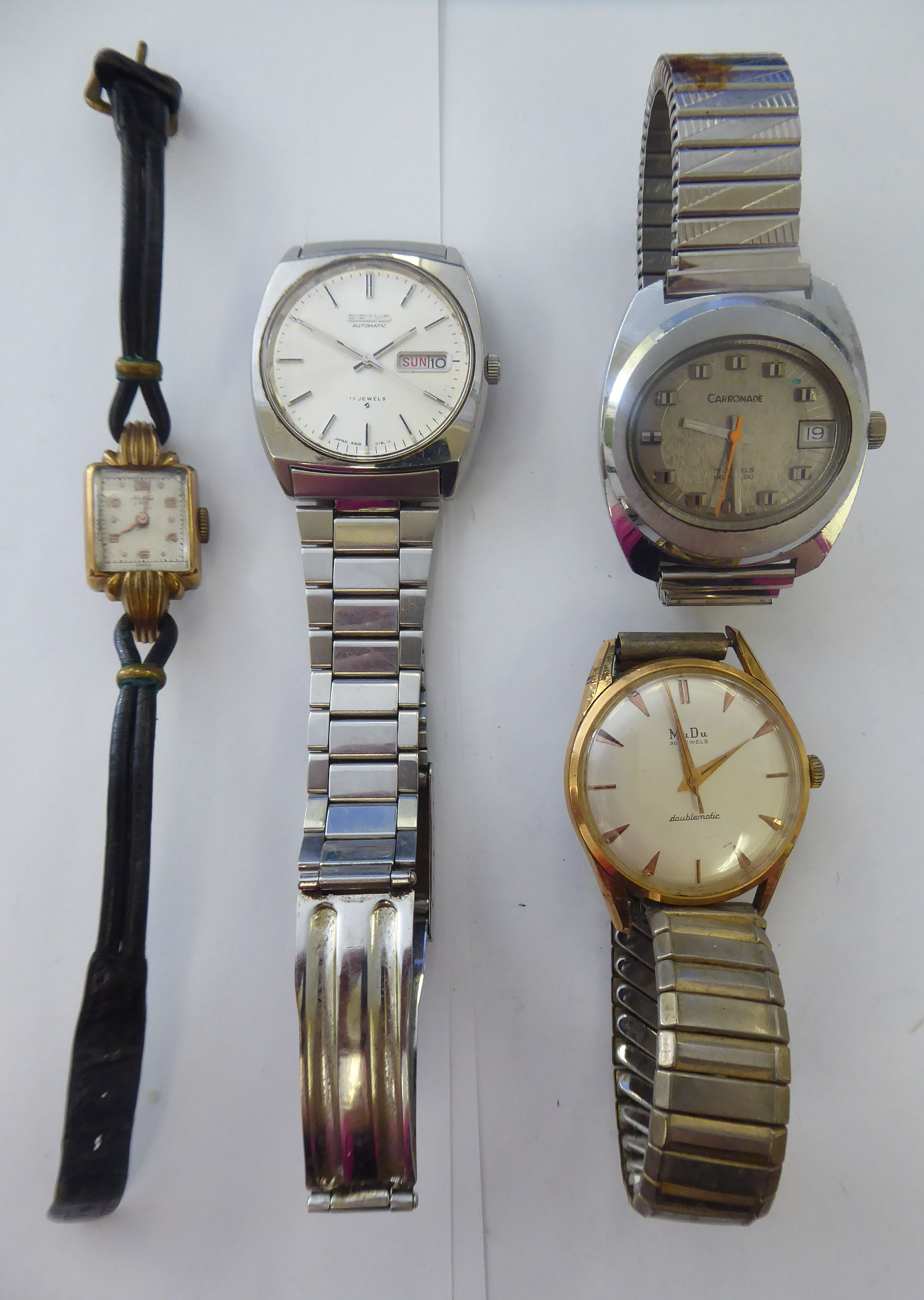 Four wristwatches: to include a MuDu Doublematic, the movement with sweeping seconds,