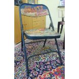 A metal folding patio chair painted with 'Billy Smart Circus' logo CA