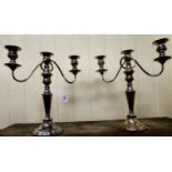 A pair of 19thC style silver plated triple, two part candelabra, each comprising a bead bordered,