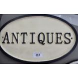 A cast metal sign 'Antiques' 8.
