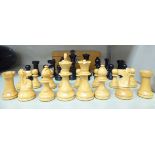 A modern Staunton black stained and naturally coloured carved and turned boxwood chess set the