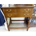 A 1930s oak canteen chest with two drawers, raised on turned and block legs,