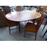 A G-Plan teak finished dining table with an integral leaf,