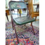 A metal folding patio chair painted with a 'Pepsi Cola' logo CA