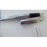 A Cross Apogee chromium plated cased fountain pen with an 18k nib (750),