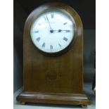 An Edwardian satinwood string inlaid mahogany round arch cased mantel timepiece;