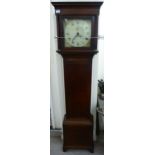 An early 19thC mahogany longcase clock, the square hood with a glazed window and flank pillars,