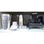 Silver plated and pewter tableware: to include a cream jug; a cocktail shaker;