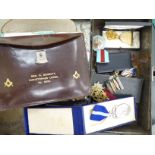 A collection of Masonic and related regalia: to include a stitched brown hide wallet;