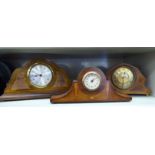 Three similar 1930s oak/mahogany cased mantel clocks;