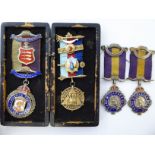 Four various Masonic related silver and enamelled medallions,