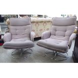 A pair of modern cushioned blackberry coloured part buttoned fabric upholstered enclosed armchairs,