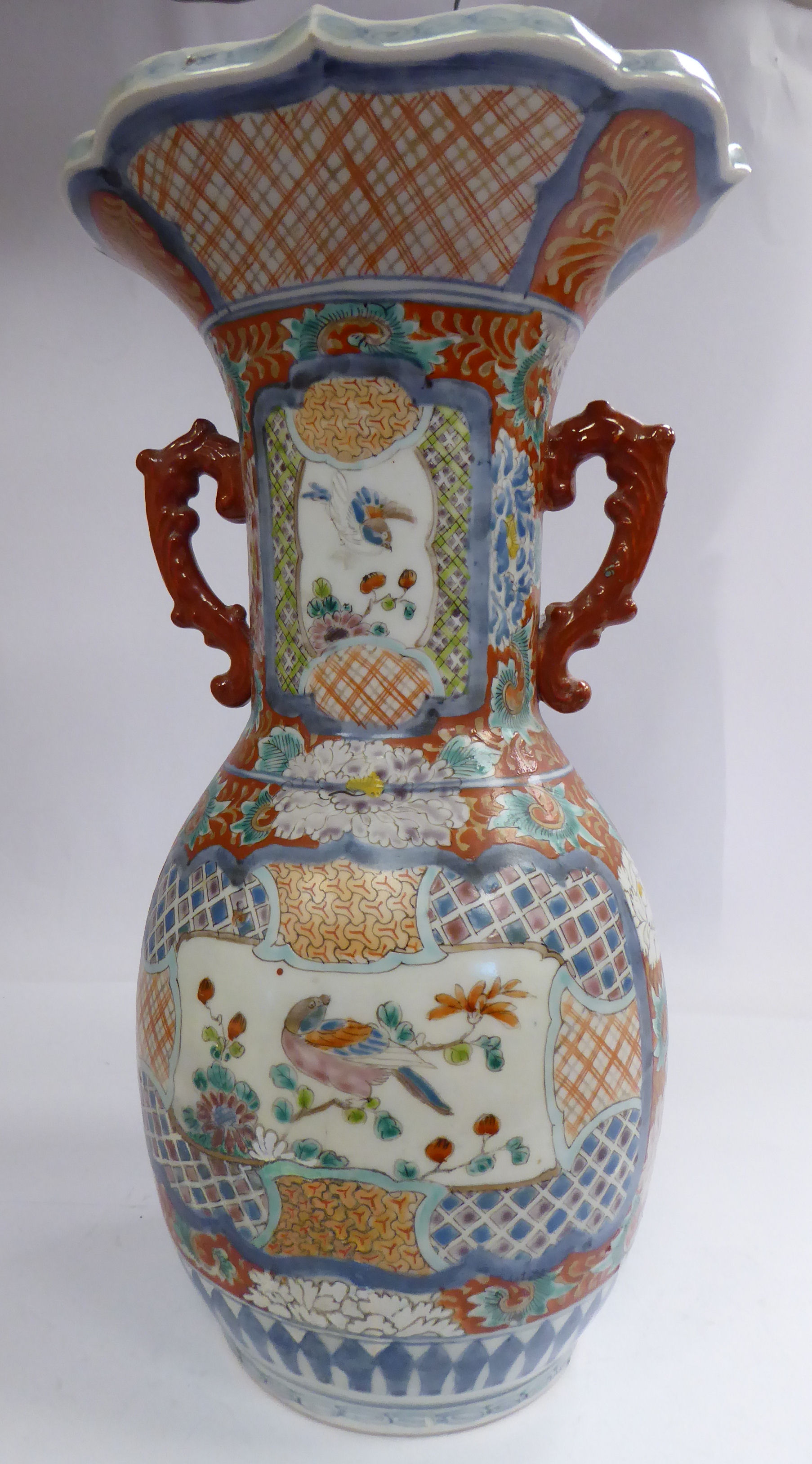 A late 19thC Japanese porcelain vase of bulbous form, the wide, straight neck having opposing,