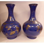 A pair of mid/late 18thC Chinese porcelain bottle vases of bulbous form with long,