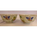 A pair of late 19thC Chinese porcelain bowls, decorated with fruit,