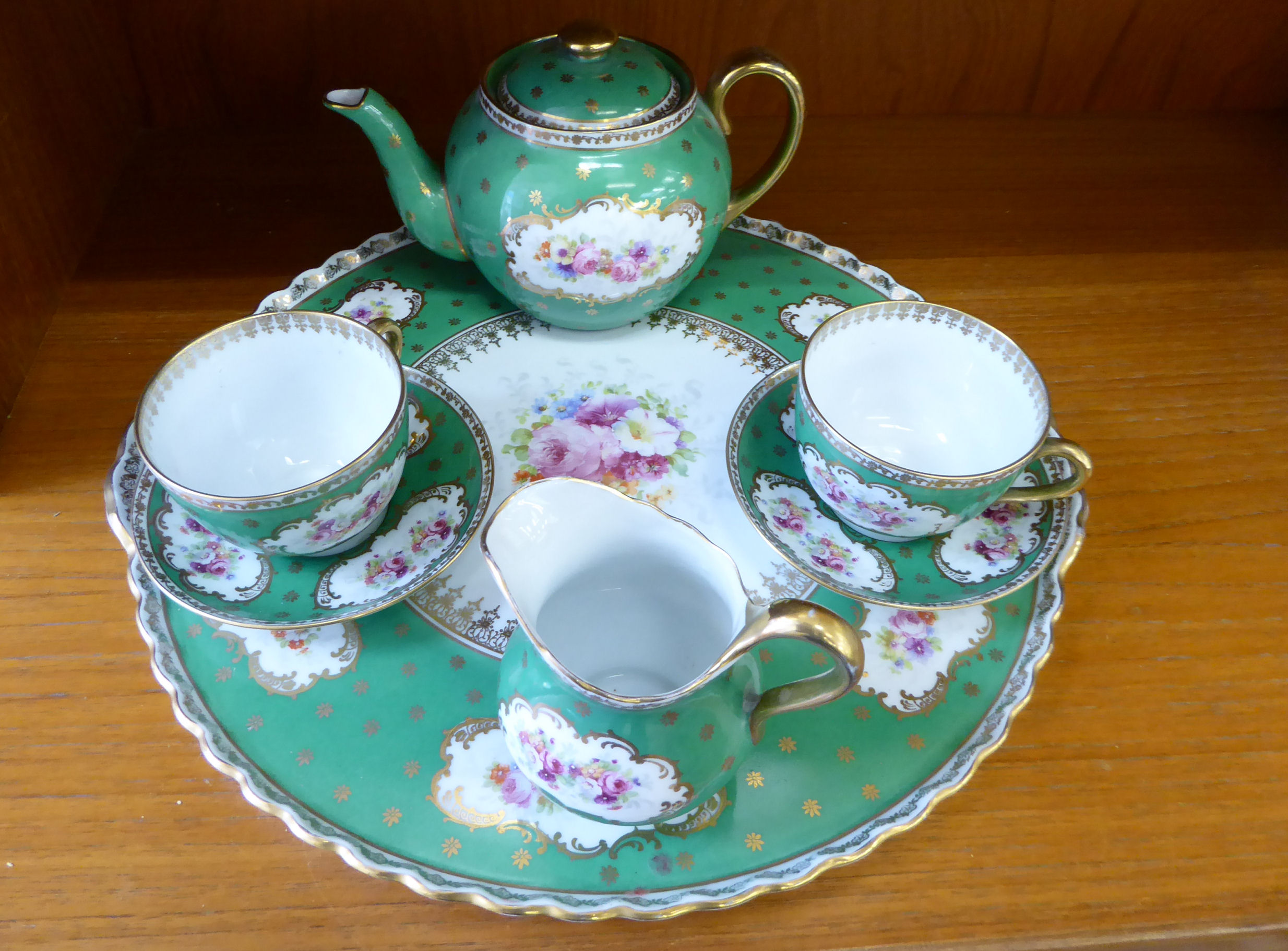 An early 20thC Continental porcelain cabaret tea set, viz.